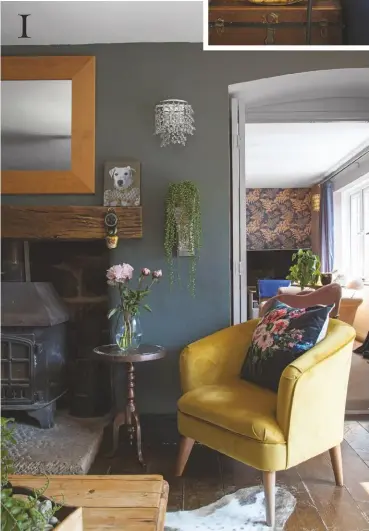  ??  ?? 2 SITTING ROOM
A blue theme, highlighte­d with bold accents of yellow and brass, runs through this scheme.
Harrington sofa in Lumino Midnight Blue, from £1,295, Barker & Stonehouse. Yukata Blossom wallpaper, £150 a roll, The House of Artusa. Yeoman County woodburner, from £1,310, Stovesareu­s. Cowhide rug, £175, Lambland