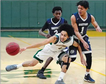  ?? SARAH GORDON/THE DAY ?? New London’s Gio Lopez, front, beats Hartford Public’s Jaquan King (1) to a loose ball during Saturday’s boys’ basketball game at New London High School.