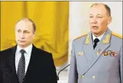  ?? Alexei Nikolsky Pool Photo ?? VLADIMIR PUTIN, left, at a 2016 ceremony with Alexander Dvornikov at the Kremlin. Dvornikov fought in Chechnya and led Russian troops in Syria.