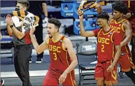  ?? Paul Sancya Associated Press ?? USC’S Isaiah Mobley (3) celebrates beating Kansas in the second round.