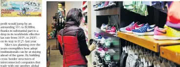  ?? /Bloomberg ?? Sneakers: A customer in a Nike store in Hanoi, Vietnam. Nike has declined to comment whether Nike Innovate CV files tax returns in any country or whether it is stateless.