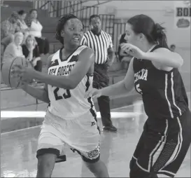  ??  ?? Sharqueva McCoy is guarded by Madison Johnson of Toccoa Falls College during Friday’s home game in Rossville. (Messenger photo/Scott Herpst)