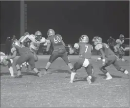  ?? STAFF PHOTOS BY TED BLACK ?? Lackey High School quarterbac­k Robert Middleton awaits the shotgun snap in the first quarter of Friday’s home game against Westlake. Middleton threw one touchdown pass and ran for another, but the Chargers were upended by the visiting Wolverines, 38-14, in the SMAC clash in Indian Head.