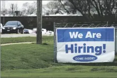  ?? NAM Y. HUH/AP ?? A hiring sign is displayed in Wheeling, Ill., on Thursday.