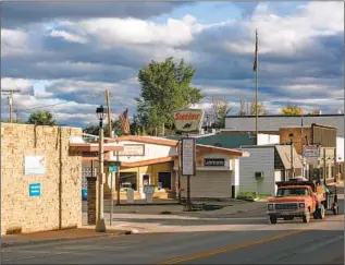  ?? ?? A TRUCK rolls through downtown Eureka, Mont. Stewart Rhodes and Tasha Adams’ homes were generally located deep in the Montana woods, and Adams says she had no friends.