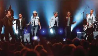  ??  ?? In this file photo, Tyler Hubbard, from right, and Brian Kelley, third from left, of Florida Georgia Line, and from left, Nick Carter, AJ McLean, Brian Littrell, and Kevin Richardson, of Backstreet Boys, perform at the 52nd annual Academy of Country...