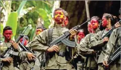  ?? NOEL CELIS/AFP ?? Guerrillas of the New People’s Army in formation in the Sierra Madre mountain range, located east of Manila, on July 30.