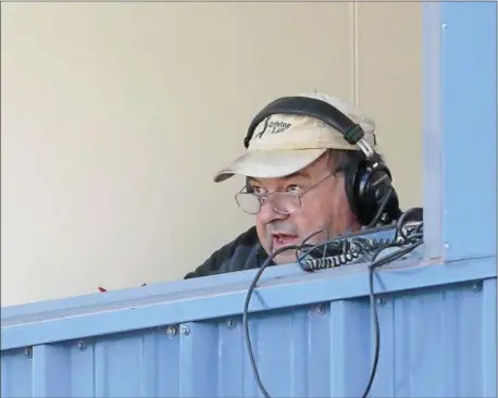  ?? JOHN BLAINE — FOR THE TRENTONIAN ?? Longtime Trentonian sportswrit­er George O’Gorman works on a radio broadcast during a high school football game. Funeral services for O’Gorman will be held Monday morning.