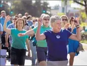  ?? Allen J. Schaben Los Angeles Times ?? REP. JULIA BROWNLEY rallies supporters at Thousand Oaks’ 50th anniversar­y parade last month.