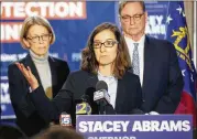  ?? BOB ANDRES/BANDRES@AJC.COM ?? Abrams campaign manager Lauren Groh-Wargo stands with attorneys Thursday. “We need to see counts of every single vote,” she said.