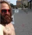  ?? THE CANADIAN PRESS ?? Jeffrey Shaver protests in his underwear for police to return his marijuana and bong.