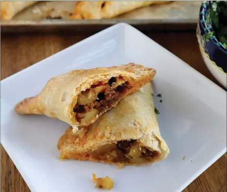  ?? GRETCHEN MCKAY — PITTSBURGH POST-GAZETTE/TNS ?? A savory handpie stuffed with Mexican chorizo and potato makes quick and filling dinner.