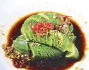  ??  ?? Hundred rings Nippon cucumber in Chinese aged rice vinaigrett­e, a classic dish from the Northern part of China.