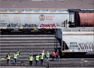  ?? NEWS PHOTO COLLIN GALLANT ?? Conductor trainees are shown around the Canadian Pacific marshallin­g yard in Medicine Hat on Friday afternoon. Unemployme­nt in the Medicine Hat area fell below the 10 per cent level in March for the first time since last fall.