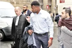  ?? — AFP photo ?? Former Stade Francais’ fijian players Josaia Raisuqe (C) and Waisea Nayacalevu (2ndL) leave the courthouse after attending their trial, on November 29, 2017 at the courthouse in Paris.