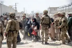  ?? (MoD/Getty) ?? The British and US armies helped to evacuate Afghans when the Taliban retook power