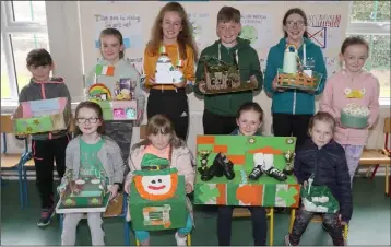  ??  ?? Back: Michaela, Holly, Rose, Conor, Kate and Ava. Front: Amy, Maddie, Mia and Isabel with their ‘Irish themed floats’ at the Seachtain na Gaeilge celebratio­ns in Clonroche National School.
