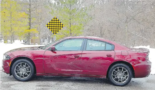  ?? BRIAN HARPER ?? The 2017 Dodge Charger SXT Rallye AWD moves with a confidence that belies its bulk.