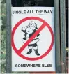  ??  ?? Local businesses post signs to let SantaCon participan­ts know they’re unwelcome.