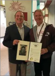  ?? SUBMITTED PHOTO ?? Senator Dinniman presents Head of School, the Reverend Edmund K. “Ned” Sherrill II, with a special Senate citation in honor of the Church Farm School’s 100th Anniversar­y.