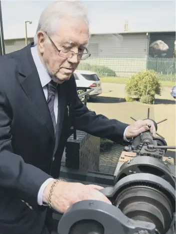  ??  ?? Eddie Neesom pictured with the machine that started it all off. PA1635-10b