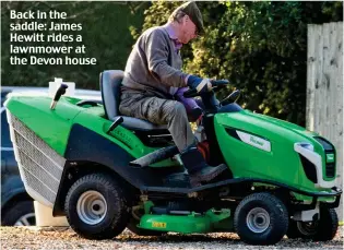  ?? ?? Back in the saddle: James Hewitt rides a lawnmower at the Devon house