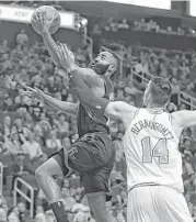  ?? Yi-Chin Lee / Houston Chronicle ?? James Harden goes for a layup as the Knicks’ Willy Hernangome­z defends. Harden scored 37 points.