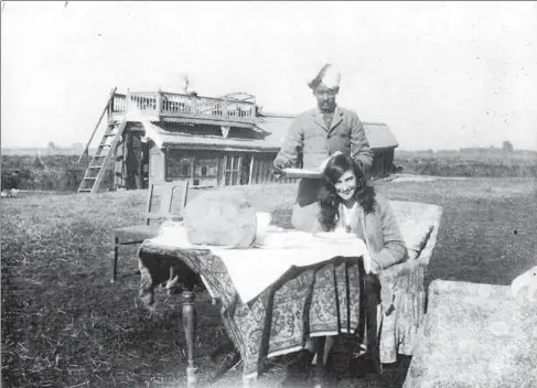  ??  ?? (Above) A 1922 picture of one of the author’s family members at the Dal Lake in Kashmir.