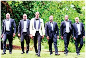  ??  ?? Asafa and his groomsmen.