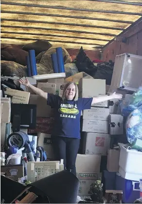  ??  ?? HEARTS founder Teresa Rocque shows off a heap of donated goods being stored in a semi-trailer until the non-profit organizati­on finds a new permanent location for its thrift centre.