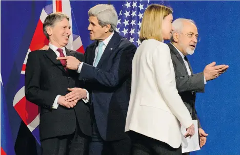  ?? JEAN-CHRISTOPHE BOTT/THE ASSOCIATED PRESS ?? From left, U.K. Foreign Secretary Philip Hammond, U.S. Secretary of State John Kerry, EU High Representa­tive for Foreign Affairs and Security Policy Federica Mogherini and Iranian Foreign Minister Javad Zarif are shown last week in Lausanne, Switzerlan­d.