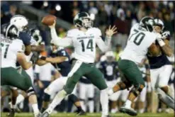  ?? CHRIS KNIGHT — THE ASSOCIATED PRESS ?? Michigan State quarterbac­k Brian Lewerke (14) throws a pass against Penn State in State College Saturday.