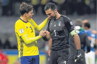  ?? Picture: Getty Images. ?? Gianluigi Buffon is consoled at the final whistle by Sweden’s Victor Lindelof.