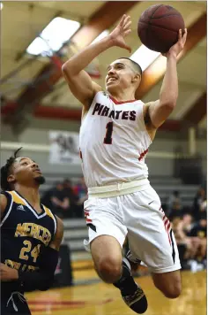  ??  ?? Above: Portervill­e College's Carlos Angel drives to the hoop Wednesday, during the second half against Merced College at Portervill­e.