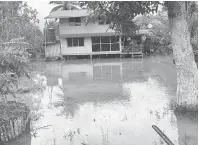  ??  ?? BANJIR: Gambar dikongsika­n PAS Sibuti, salah sebuah kediaman di Kampung Masjid dilanda banjir kelmarin.