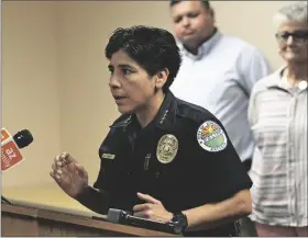  ?? Buy these photos at yumaSun.com PHOTOS By RANDy HOEFT/YUMA SUN ?? SOMERTON POLICE CHIEF ARACELI JUAREZ addresses the media during a news conference with U.S. Sen. Mark Kelly (D-Ariz.) Friday afternoon inside the conference room at the Yuma County Department of Developmen­t Services, 2351 W. 26th St. In the background are Somerton Mayor Gerardo Anaya (left) and Yuma County Supervisor Lynne Pancrazi.