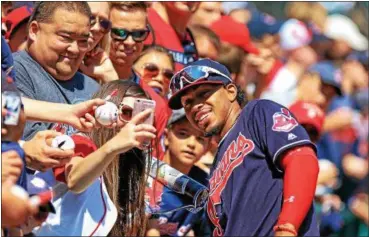  ?? TIM PHILLIS — THE NEWS-HERALD ?? Francisco Lindor greets fans before the Indians’ loss to the Nationals on July 27 at Progressiv­e Field.