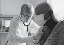  ?? NETFLIX VIA AP ?? Dr. Lisa Sanders examines a patient in a scene from the new Netflix series “Diagnosis,” which transports Sanders’ column from the pages of The New York Times to television.