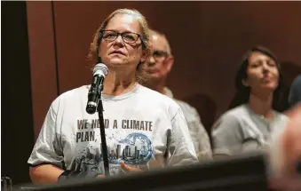  ?? Elizabeth Conley / Staff photograph­er ?? “My life has been on hold for three years,” says Sheila Blake, who asked questions at Houston Climate Movement’s town hall on Saturday. Blake’s home has flooded three times in three years.