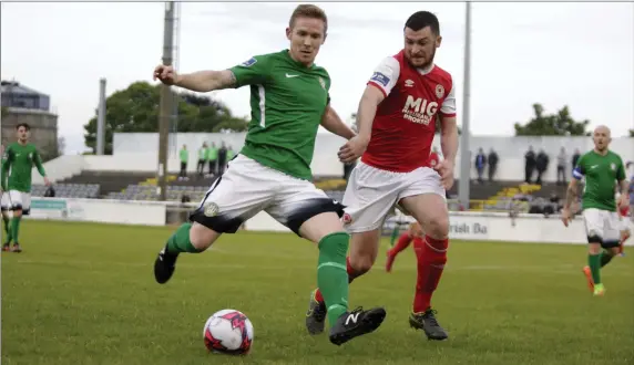  ??  ?? Conor Kenna in control as Ryan Brennan closes in during the Bray Wanderers v St Pat’s clash at the Carlisle.