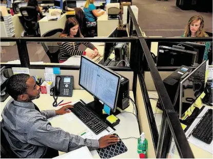  ?? Jerry Baker / For the Chronicle ?? Clerks John Allen, Jennifer Kessinger, left, and Nicole Cano work on processing informatio­n to make dealing with the Harris County Courthouse Humble Annex easier for citizens and other courts. Precinct 4, Place 2 Judge Laryssa Korduba said her pledge...