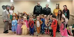  ?? ?? ● Children and staff from Monkey Puzzle Nursery with officers Dave Jackson and Laura Rowling, having enjoyed World Book Day with Southport College students