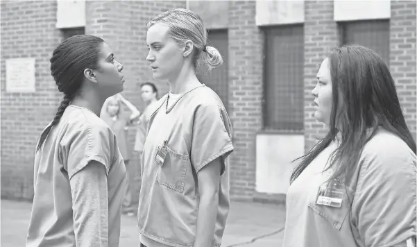  ?? JOJO WHILDEN, NETFLIX ?? Jessica Pimentel, left, Taylor Schilling and new arrival Jolene Purdy mix it up at Litchfield prison for Season 4 of Orange Is the New Black.