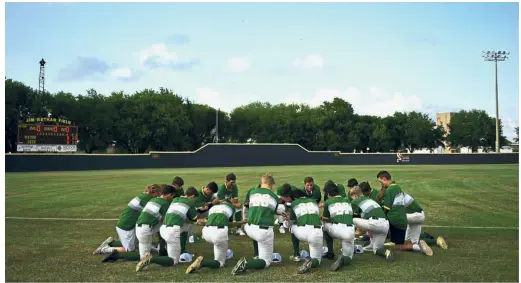  ?? — AFP ?? Thirty-six hours after several classmates were gunned down, Santa Fe High School athletes took to the field to partake in a longstandi­ng and, for at least one evening, healing Texas pastime: baseball.