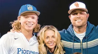  ?? TRIBUNE CONTENT AGENCY ?? The Orioles selected Oklahoma high school shortstop Jackson Holliday, left, the son of seven-time All-Star Matt Holliday, right, with the first overall pick in the 2022 MLB draft. Matt’s wife, Leslee, is also pictured.