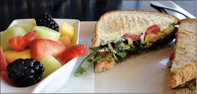  ?? Arkansas Democrat-Gazette/JENNIFER NIXON ?? Fruit and a Vegetable and Boursin Panini make a fresh and tasty lunch at 42 Bar and Table.