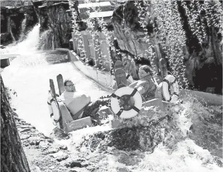  ??  ?? Visitors ride Smoky Mountain River Rampage at Dollywood in Pigeon Forge, Tenn., in 2017.