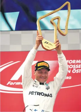  ?? Picture: AFP ?? TAKE A BOW. Mercedes’ Finnish driver Valtteri Bottas celebrates on the podium after winning the Austrian Formula One Grand Prix at the Red Bull Ring in Spielberg yesterday.
