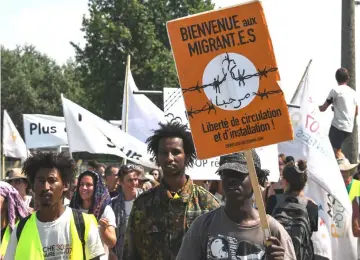  ?? — AFP photos ?? Taking part a “solidarity” march in support of migrants in Calais. Several hundred people took part in the march, organised by French charity L’Auberge des migrants and supported by numerous NGOs.