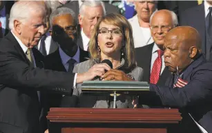  ?? Chip Somodevill­a / Getty Images ?? Former Rep. Gabby Giffords, who was shot in an assassinat­ion attempt in 2011, addresses a rally honoring the Las Vegas shooting victims on Wednesday.